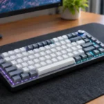 Grey and white AULA F75 mechanical keyboard on a dark desk mat ready for software configuration.